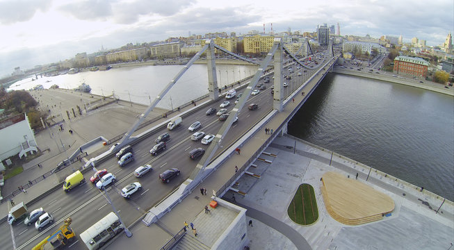 Cars on Krymsky Bridge and panorama of Moscow, Russia.