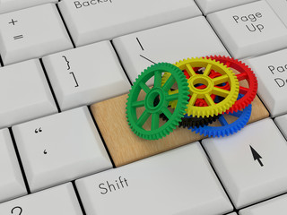 Laptop Keyboard With Colorful Cog On wood Enter Key