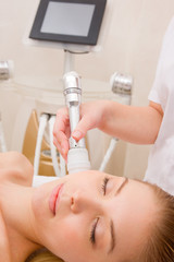 Woman getting light pulsed hair removal treatment
