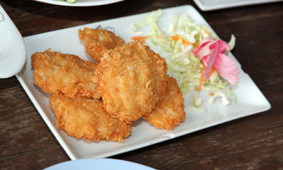 Fried shrimp of foods cake in white dish.