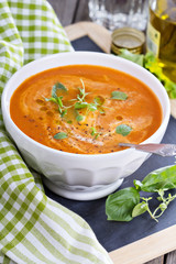 Tomato soup in white bowl