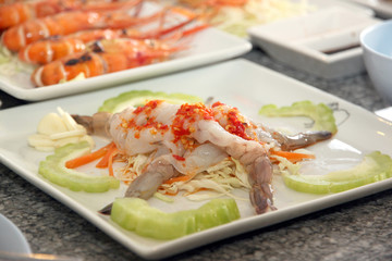seafood salad of shrimp on white dish.