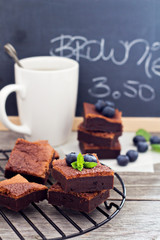 Stacked brownies with a cup of tea