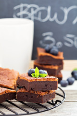 Stacked brownies with a cup of tea