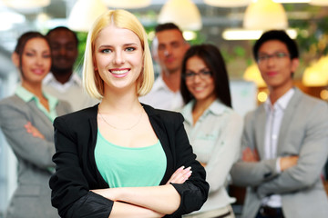 Patriotic businesswoman standing with USA flag 