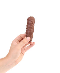 Hand holding tasty chocolate bar.