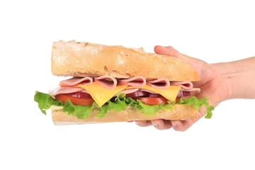 Poster Großes frisches Sandwich in den Händen. © indigolotos