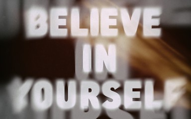Believe in yourself word on blurred background
