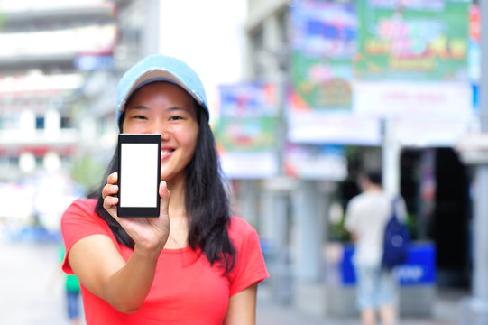 woman hands hold blank smart phone  in modern city
