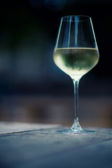 color image of chilled white wine in a glass , with copy space
