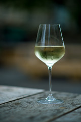 color image of chilled white wine in a glass , with copy space
