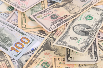 Close up of different dollar bills.