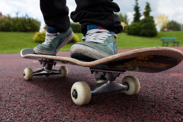 Young person rides on skateboard