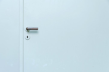 metal door with handle and keyhole