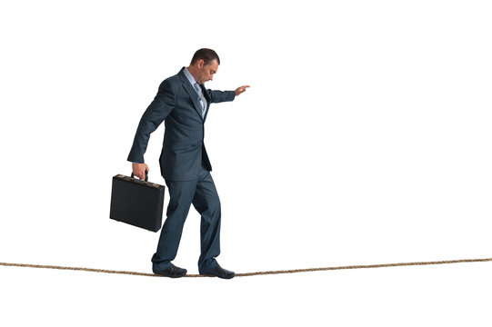 Isolated Businessman Balancing Tightrope