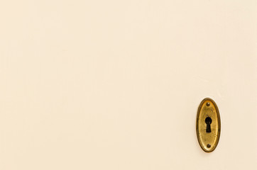 wooden door with vintage keyhole