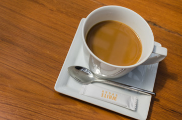 A cup of hot coffee on the table