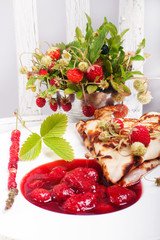 Pancakes with fresh strawberries and jam