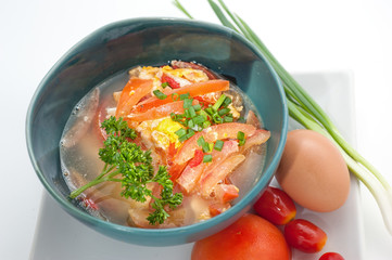 Asian traditional soup with tomato and egg