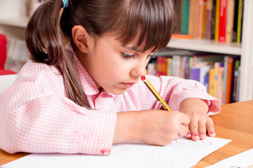 Little girl learning to write