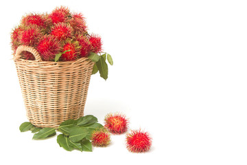 Fresh rambutan with leaf on the basket