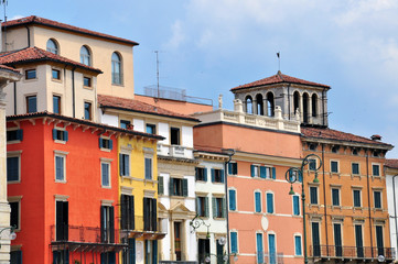 Fototapeta na wymiar Facade of multicolor houses in Verona