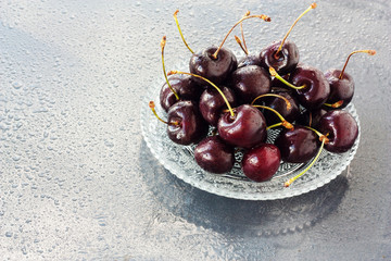 Cherries on   the wet background