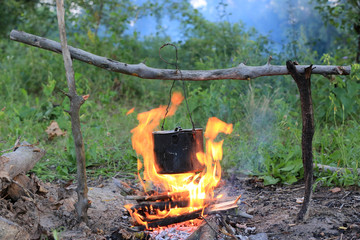 smoked kettle on camp fire