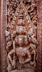 Old wooden door were carved Thai pattern