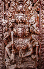 Old wooden door were carved Thai pattern
