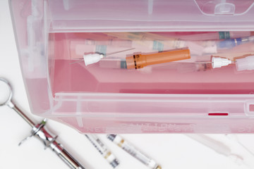 Inserting Medical / Dental waste into sharps container