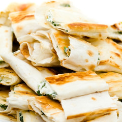 Fresh sandwich appetizers closeup. Small lavash rolls.