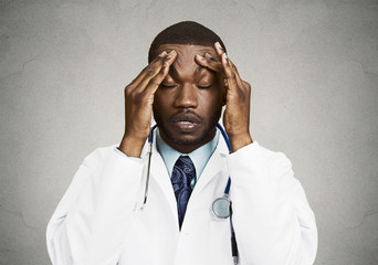 Stressed doctor, health care professional, grey wall background