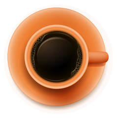 An orange cup with a coffee