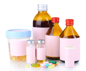 Pills and medicine bottles isolated on white