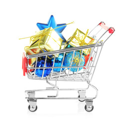 Christmas gifts in shopping trolley, isolated on white