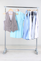 Office clothes on hangers, on gray background