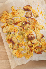Homemade potato chips on table, close up