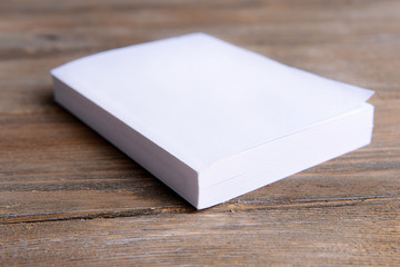 White book on wooden table, close-up