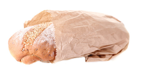 Loaf in paper bag isolated on white