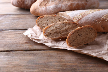 Fresh bread on wooden background
