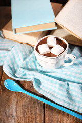 Cup of hot chocolate on table, close up