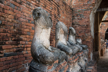 Fototapeta na wymiar row of ruin buddha statue in wat chai wattanaram, ayutthaya, tha
