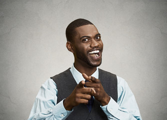 Happy businessman pointing fingers at you, laughing 