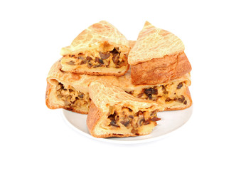 Mushroom pie on plate on white background