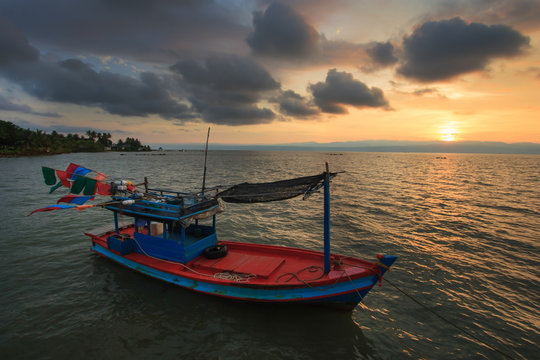 fishing boat in the sea sunset