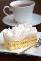 close up coconut cake in white dish