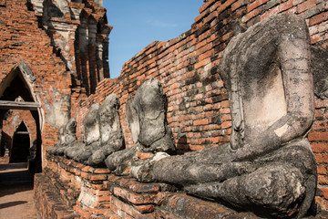 Fototapeta na wymiar row of ruin buddha statue in wat chai wattanaram, ayutthaya, tha