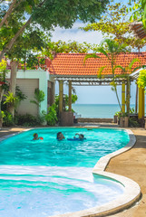 family party in swimming pool on holiday.