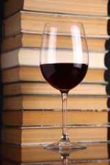 Wine glass and books